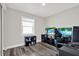 Bright bedroom features one window and dark wood floors at 6020 N 50Th St, Tampa, FL 33610