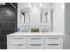 Bathroom with a double vanity, ample storage, and modern finishes at 612 Sw Beverly Ave, Largo, FL 33770
