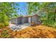 Charming home featuring a cozy porch, modern paint, and a paved outdoor area at 612 Sw Beverly Ave, Largo, FL 33770