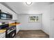 Bright kitchen with stainless steel appliances, butcher block counters, and white cabinetry at 612 Sw Beverly Ave, Largo, FL 33770