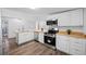 Bright kitchen with butcher block counters and stainless steel appliances at 612 Sw Beverly Ave, Largo, FL 33770