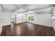 Bright living room with coffered ceilings, wood-look floors, and natural light coming through windows at 612 Sw Beverly Ave, Largo, FL 33770