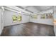 Bright and airy living room featuring large windows, light wood flooring, and neutral walls at 612 Sw Beverly Ave, Largo, FL 33770