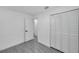 Bright bedroom showcases a closet and wood-look tile flooring at 6507 La Mesa Cir, Tampa, FL 33634