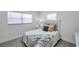 Well-lit bedroom with ample natural light, stylish decor, and a comfortable bed at 6507 La Mesa Cir, Tampa, FL 33634