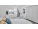 Bright bedroom featuring a closet, dresser, and a doorway to the bathroom at 6507 La Mesa Cir, Tampa, FL 33634