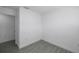Neutral bedroom featuring light wood-look tile flooring and a doorway at 6507 La Mesa Cir, Tampa, FL 33634
