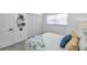 Cozy bedroom featuring a window, closet, and a bed with patterned throw pillows and blanket at 6507 La Mesa Cir, Tampa, FL 33634