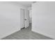White bedroom featuring light wood-look tile flooring and a closet at 6507 La Mesa Cir, Tampa, FL 33634