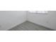 Bright bedroom with clean lines, neutral tones, and wood-look tile flooring at 6507 La Mesa Cir, Tampa, FL 33634
