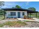 Charming single-story home featuring a covered carport and a beautifully maintained front yard at 6507 La Mesa Cir, Tampa, FL 33634