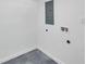 Laundry room shows hookups and electrical panel at 6507 La Mesa Cir, Tampa, FL 33634