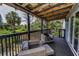 Relaxing screened in back porch with comfortable seating and a view of lush greenery at 6521 Oelsner St, New Port Richey, FL 34652