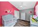 Charming Bedroom with colorful decor, wood-look floors, and ample closet space at 6521 Oelsner St, New Port Richey, FL 34652