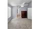 Bright bedroom with carpet, closet, and ceiling fan at 6521 Oelsner St, New Port Richey, FL 34652
