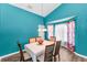 Charming dining room with a modern chandelier and room for entertaining at 6521 Oelsner St, New Port Richey, FL 34652