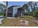 Exterior of home featuring a covered stairway and attached garage at 6521 Oelsner St, New Port Richey, FL 34652