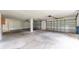 Spacious three-car garage with concrete flooring and ample storage space at 6521 Oelsner St, New Port Richey, FL 34652
