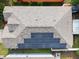 Aerial view of a house with a newer roof and solar panels providing energy efficiency, located in a friendly neighborhood at 6914 Monarch Park Dr, Apollo Beach, FL 33572