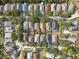 Aerial view featuring neatly arranged homes with mature trees lining the streets in a residential community at 6914 Monarch Park Dr, Apollo Beach, FL 33572