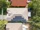 Aerial view of a home with solar panels on the roof and a fenced in backyard at 6914 Monarch Park Dr, Apollo Beach, FL 33572