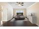 Bright bedroom featuring a ceiling fan, and a beautifully styled bed at 6914 Monarch Park Dr, Apollo Beach, FL 33572