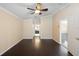 Open bedroom layout with hardwood floors, ceiling fan, and natural light at 6914 Monarch Park Dr, Apollo Beach, FL 33572