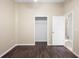 Bedroom offering an open closet and adjacent doorway, providing both storage solutions and easy flow throughout the house at 6914 Monarch Park Dr, Apollo Beach, FL 33572