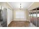 Dining area featuring tile flooring, backyard access, and natural light at 6914 Monarch Park Dr, Apollo Beach, FL 33572