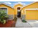 Inviting entryway featuring tile and hardwood floors with an arched window over the front door at 6914 Monarch Park Dr, Apollo Beach, FL 33572