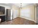 Eat-in kitchen features stainless steel fridge, and large window overlooking backyard at 6914 Monarch Park Dr, Apollo Beach, FL 33572