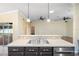 Kitchen overlooking living area, featuring stainless steel sink and appliances at 6914 Monarch Park Dr, Apollo Beach, FL 33572