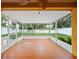 The screened patio has tile flooring and a view of the fenced in yard at 6914 Monarch Park Dr, Apollo Beach, FL 33572
