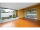 Spacious screened porch features an overhead fan, tiled floors, and sliding glass door access to the backyard at 6914 Monarch Park Dr, Apollo Beach, FL 33572