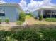 Landscaped backyard featuring lush greenery and mature shrubs, providing a serene outdoor space at 804 67Th W St, Bradenton, FL 34209
