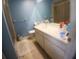This bathroom features a well-lit vanity with a modern sink and a shower at 804 67Th W St, Bradenton, FL 34209