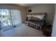 Spacious bedroom with patio access, featuring a bunk bed and natural lighting at 804 67Th W St, Bradenton, FL 34209