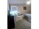 Bedroom featuring a chair and window at 804 67Th W St, Bradenton, FL 34209