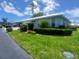 Lovely single-story home with a well-kept lawn and colorful flowers enhances its curb appeal at 804 67Th W St, Bradenton, FL 34209