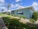 Well-maintained single-story home with lush front lawn, manicured shrubs, and mature landscaping at 804 67Th W St, Bradenton, FL 34209