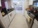 Kitchen featuring white cabinets, black countertops, and stainless appliances at 804 67Th W St, Bradenton, FL 34209