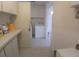 Practical laundry area featuring counter space, cabinets, and modern laundry appliances at 804 67Th W St, Bradenton, FL 34209