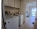 Bright laundry room featuring a washer and dryer for convenient in-home laundry at 804 67Th W St, Bradenton, FL 34209