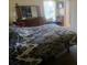 A generously sized main bedroom offers a comfortable retreat with a large window and lots of storage at 804 67Th W St, Bradenton, FL 34209