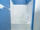 Bathroom with a tub and shower combo and a bright white tile surround at 8545 Hunters Key Cir, Tampa, FL 33647