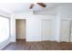 Open bedroom featuring hardwood floors, a ceiling fan, and closet space at 8545 Hunters Key Cir, Tampa, FL 33647