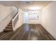 Spacious living area with hardwood floors, modern lighting, and staircase access at 8545 Hunters Key Cir, Tampa, FL 33647