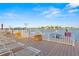 Relaxing dock area with lounge chairs and beautiful waterfront views at 8921 Blind Pass Rd # 142, St Pete Beach, FL 33706