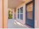 Inviting condo entrance featuring a private covered area and a view of lush landscaping at 8921 Blind Pass Rd # 142, St Pete Beach, FL 33706