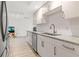 Bright kitchen showcasing stainless steel appliances, granite countertops, and sleek cabinets at 8921 Blind Pass Rd # 142, St Pete Beach, FL 33706